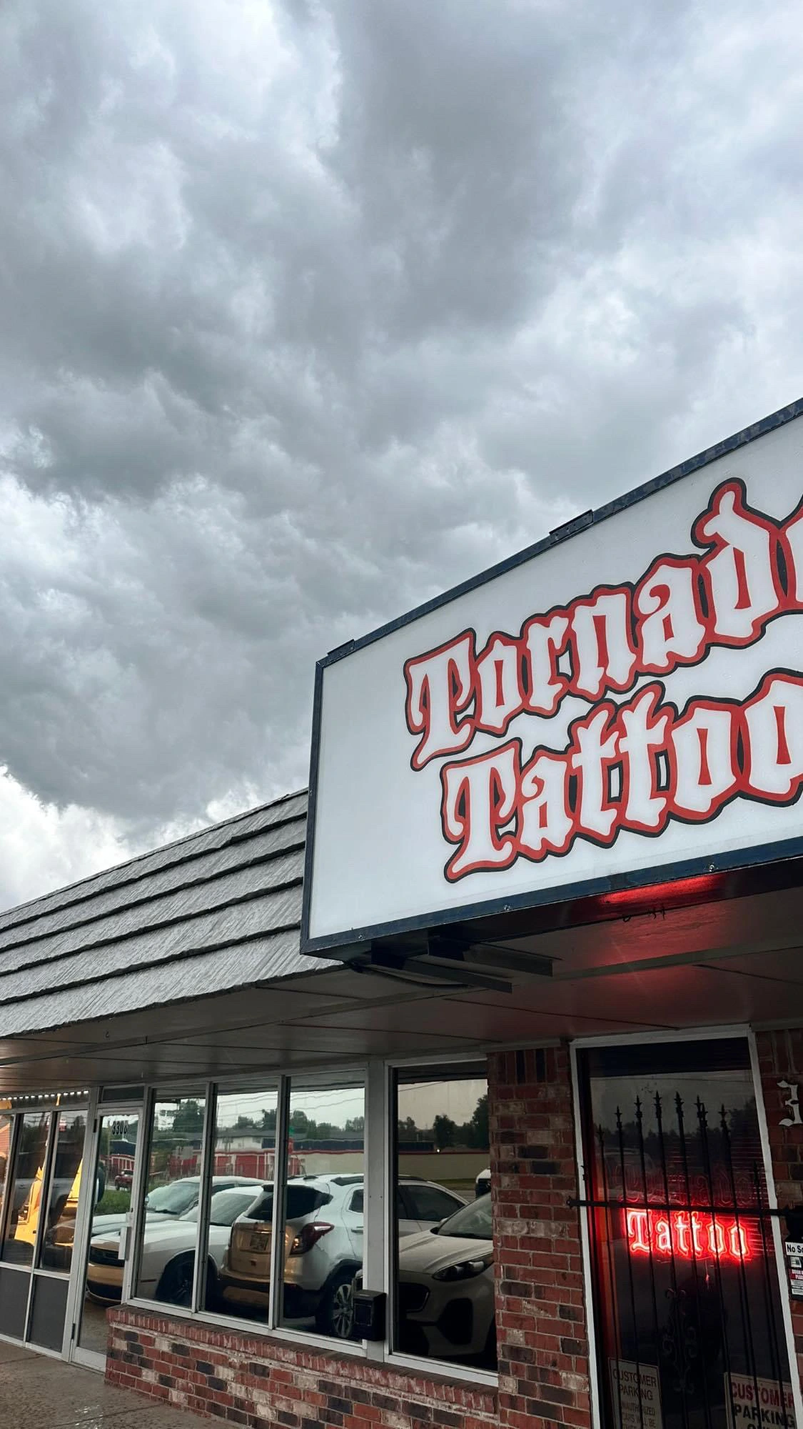 Exterior storefront and Tornado Tattoo sign at 3306 North MacArthur Boulevard in Oklahoma City